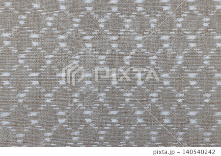 Woven textile background with repeating trellis design 140540242