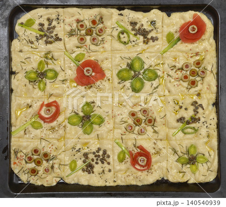 Floral garden focaccia bread dough in baking sheet Floral garden focaccia bread dough in baking sheet 140540939