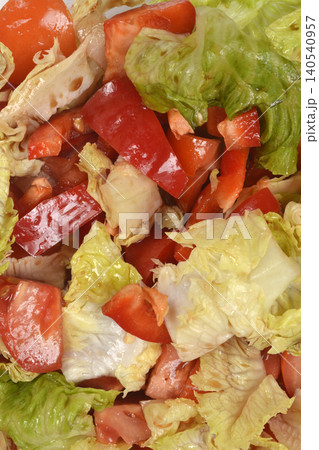 Fresh tomato and lettuce salad texture close up Fresh tomato and lettuce salad texture close up 140540957