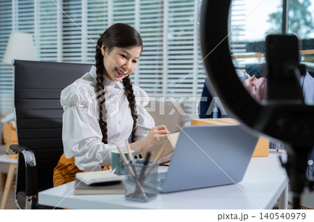 Small business entrepreneur SME freelance woman working at home office, boxs ,tablet and laptop online, marketing, packaging, delivery, e-commerce concept. Small business entrepreneur SME freelance woman working at home office, boxs ,tablet and laptop online, marketing, packaging, delivery, e-commerce concept. 140540979
