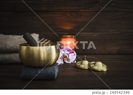 A calming wellness scene featuring a singing bowl A calming wellness scene featuring a singing bowl 140542399