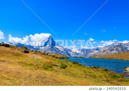 View of Stelli Lake (Stellisee) and Matterhorn mountain at summer in Zermatt, Swiss Alps, Switzerland View of Stelli Lake (Stellisee) and Matterhorn mountain at summer in Zermatt, Swiss Alps, Switzerland 140542810