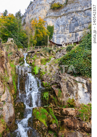 St. Beatus Waterfall at St. Beatus Caves entrance in Beatenberg, Bernese Oberland, Switzerland St. Beatus Waterfall at St. Beatus Caves entrance in Beatenberg, Bernese Oberland, Switzerland 140542837