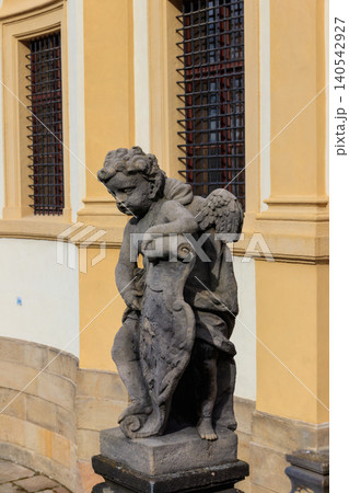 Baroque statue before facade Loreta Monastery in Prague, Czech Republic Baroque statue before facade Loreta Monastery in Prague, Czech Republic 140542927