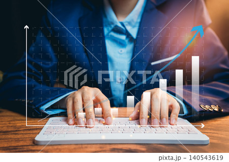 Business chart concept. Business professional using keyboard with digital growth chart representing success and productivity in modern workspace 140543619