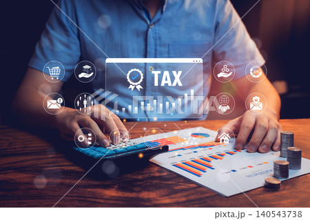 Tax concept. Businessman Using Calculator for Tax Preparation with Digital Interface and Financial Reports on Table Tax concept. Businessman Using Calculator for Tax Preparation with Digital Interface and Financial Reports on Table 140543738
