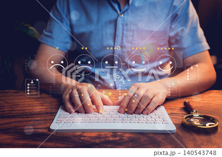 Business rating review. Businessman Typing on Keyboard with Emotional Feedback Icons and Assessment Metrics in a Modern Workspace Setting Business rating review. Businessman Typing on Keyboard with Emotional Feedback Icons and Assessment Metrics in a Modern Workspace Setting 140543748