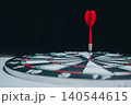 Business Target concept. Red Dart Sticking in the Bullseye of a Dartboard Against a Dark Background 140544615