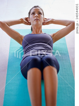 Woman, sit ups for fitness on exercise mat, health and wellness for body mobility workout. Training, resilience or strength and six pack or strong abdomen, active sport or energy in living room Woman, sit ups for fitness on exercise mat, health and wellness for body mobility workout. Training, resilience or strength and six pack or strong abdomen, active sport or energy in living room 140544931