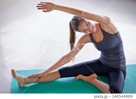 Smile, fitness and woman stretching on yoga mat on floor for exercise, wellness and healthy body. Pilates, flexibility and happy person practice in gym for wellbeing, warm up and physical activity Smile, fitness and woman stretching on yoga mat on floor for exercise, wellness and healthy body. Pilates, flexibility and happy person practice in gym for wellbeing, warm up and physical activity 140544989
