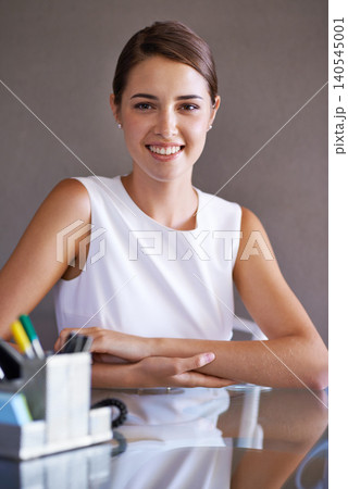 Portrait, business and woman at her desk, professional and confident with talent scout and employee. Face, person and entrepreneur with startup and artist agency with stylish outfit and stationery Portrait, business and woman at her desk, professional and confident with talent scout and employee. Face, person and entrepreneur with startup and artist agency with stylish outfit and stationery 140545001