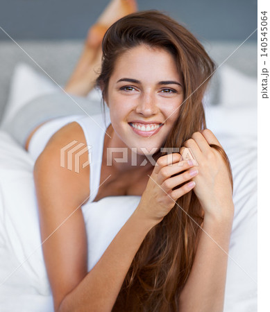 Morning, smile and portrait of woman in bed with wellness, confidence and happy in apartment. Face, relax and girl in bedroom with peace, calm and wake up for healthy sleep, comfort and natural rest. Morning, smile and portrait of woman in bed with wellness, confidence and happy in apartment. Face, relax and girl in bedroom with peace, calm and wake up for healthy sleep, comfort and natural rest. 140545064