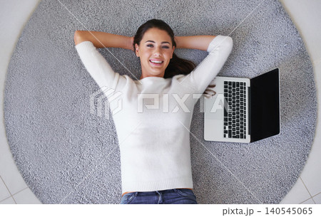 Happy woman, portrait and relax with laptop on floor above for break, rest or research at home. Top view of female person or freelancer with smile, computer or carpet rug with mockup screen at house Happy woman, portrait and relax with laptop on floor above for break, rest or research at home. Top view of female person or freelancer with smile, computer or carpet rug with mockup screen at house 140545065