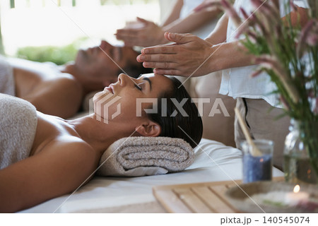 Sleep, head massage and couple relax in spa for care of body with rest on table of retreat for honeymoon. Hotel, man and woman together in resort for health, wellness and luxury for skincare Sleep, head massage and couple relax in spa for care of body with rest on table of retreat for honeymoon. Hotel, man and woman together in resort for health, wellness and luxury for skincare 140545074