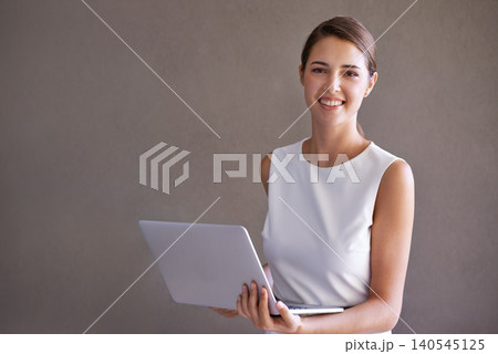 Business, portrait and woman with laptop, smile and entrepreneur on a studio background. Person, connection or PR consultant with a computer or internet with website information, tech or confidence Business, portrait and woman with laptop, smile and entrepreneur on a studio background. Person, connection or PR consultant with a computer or internet with website information, tech or confidence 140545125