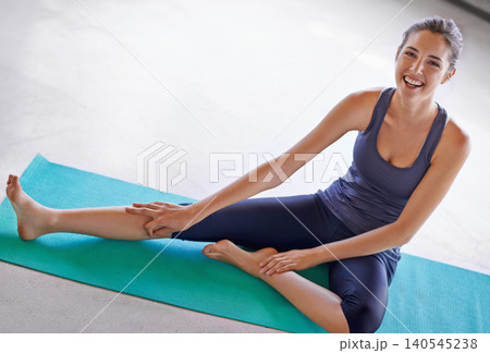 Portrait, happy woman and stretching legs on yoga mat on floor for exercise, wellness and healthy body. Pilates, gym and flexible person in warm up for practice, laughing or mockup space in Australia 140545238