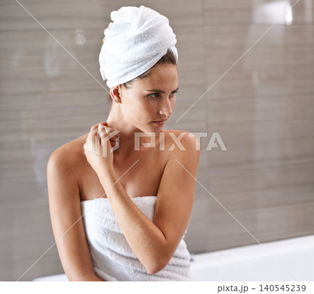 Bathroom, woman and thinking with towel for skincare and hygiene for cleanliness or wellness for self care. Person, morning shower routine for pamper or treatment for body dermatology and fresh glow. 140545239