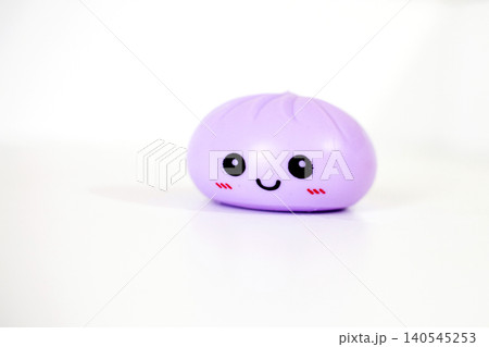 Purple kawaii squishy dumpling antistress toy on white background Purple kawaii squishy dumpling antistress toy on white background 140545253