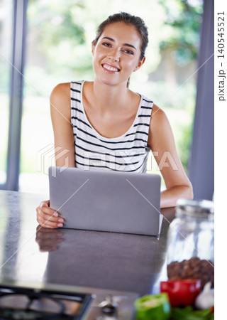 Kitchen, portrait and woman search with laptop for cooking, recipe and food guide for dinner. Happy, chef and girl typing on computer and learning from blog about nutrition, diet and information Kitchen, portrait and woman search with laptop for cooking, recipe and food guide for dinner. Happy, chef and girl typing on computer and learning from blog about nutrition, diet and information 140545521