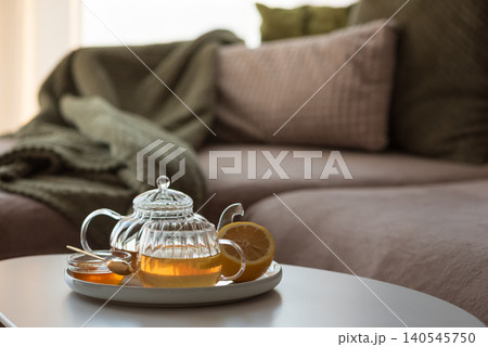 Herbal tea set with lemon and honey on coffee table Herbal tea set with lemon and honey on coffee table 140545750