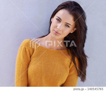 Portrait, fashion and serious young woman or model in an outfit isolated on a purple wall background. Face, trendy and confident female person in casual clothes, apparel or stylish sweater in Italy Portrait, fashion and serious young woman or model in an outfit isolated on a purple wall background. Face, trendy and confident female person in casual clothes, apparel or stylish sweater in Italy 140545765