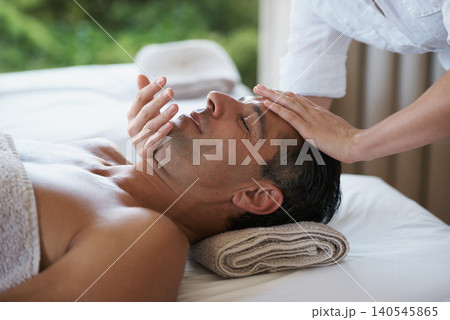 Relax, face massage and man at salon for skincare, peace and calm at luxury resort at table for wellness. Beauty, therapy and masseuse at spa for head treatment, health and hands of person pampering Relax, face massage and man at salon for skincare, peace and calm at luxury resort at table for wellness. Beauty, therapy and masseuse at spa for head treatment, health and hands of person pampering 140545865