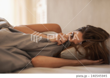 Relax, portrait and woman in bed at her home on weekend morning for calm, rest or sleeping. Confident, beautiful and young female person laying with duvet blanket in bedroom at apartment in Canada. 140545945