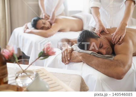 Spa, back massage to relax and couple with masseuse for luxury pamper treatment together. Beauty, wellness or therapy with mature husband and wife at resort or salon for natural stress relief Spa, back massage to relax and couple with masseuse for luxury pamper treatment together. Beauty, wellness or therapy with mature husband and wife at resort or salon for natural stress relief 140546085