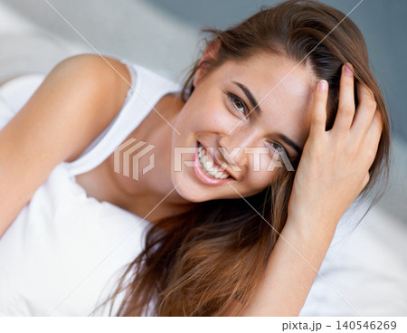 Smile, relax and portrait of woman in bed with wellness, confidence and happy in apartment. Face, morning and girl in bedroom with peace, calm and wake up for healthy sleep, comfort and natural rest. 140546269