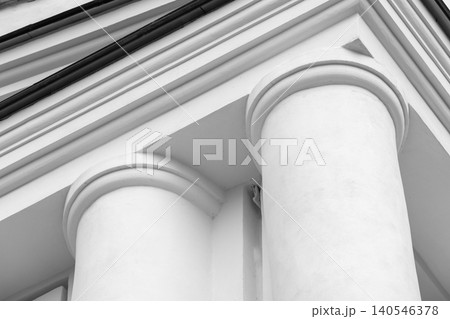 White classical building facade with round pillars and pediment White classical building facade with round pillars and pediment 140546378