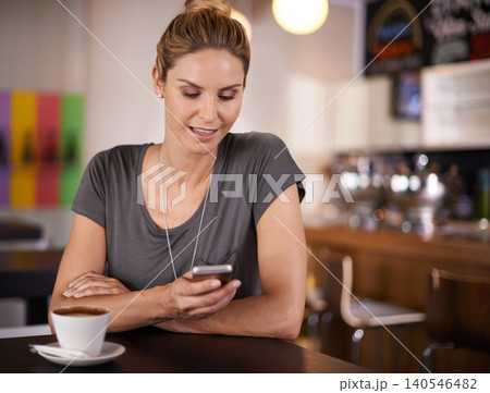 Happy woman, typing and phone with coffee at cafe for communication, social media or networking. Female person with smile on mobile smartphone for online chatting, texting or app at indoor restaurant Happy woman, typing and phone with coffee at cafe for communication, social media or networking. Female person with smile on mobile smartphone for online chatting, texting or app at indoor restaurant 140546482