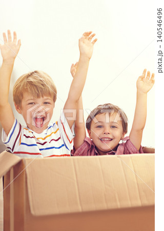 Box, children or portrait of siblings playing in house for fun, bonding or hands up game. Cardboard, learning and excited kids in living room for celebration, imagine or rollercoaster fantasy at home 140546496