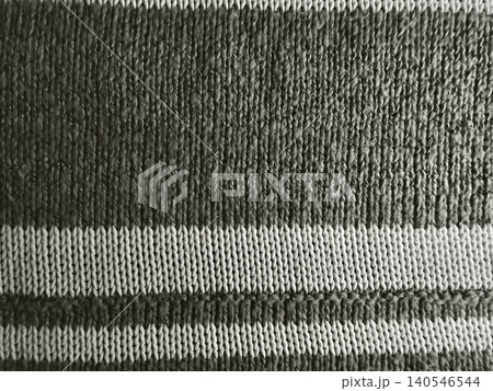 striped knitted fabric texture in cozy macro closeup with bold black and white horizontal ribbed bands striped knitted fabric texture in cozy macro closeup with bold black and white horizontal ribbed bands 140546544