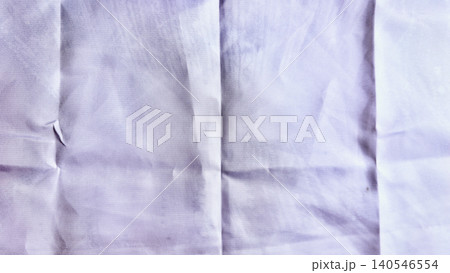 crumpled white linen closeup with intricate wrinkles subtle tear and soft lavender glow evoking calm authenticity crumpled white linen closeup with intricate wrinkles subtle tear and soft lavender glow evoking calm authenticity 140546554