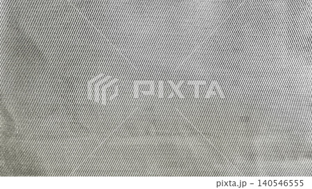 silver gray woven fabric texture closeup showcases intricate diagonal threads and soft natural folds silver gray woven fabric texture closeup showcases intricate diagonal threads and soft natural folds 140546555