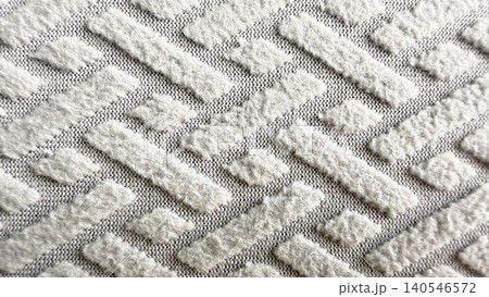 luxurious white plush textured fabric displays geometric raised patterns in soft minimalist macro detail luxurious white plush textured fabric displays geometric raised patterns in soft minimalist macro detail 140546572