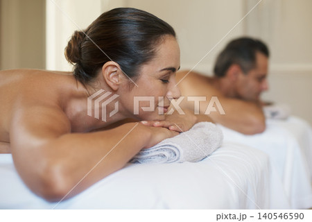 Massage, relax and couple in spa for wellness, rest and therapy on holiday or vacation for break and pamper. Young people and smile with head on towel for holistic care and peace for calm on table Massage, relax and couple in spa for wellness, rest and therapy on holiday or vacation for break and pamper. Young people and smile with head on towel for holistic care and peace for calm on table 140546590
