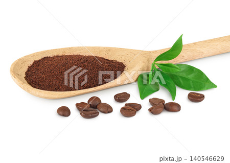 ground coffee in wooden spoon and coffee beans isolated on white background ground coffee in wooden spoon and coffee beans isolated on white background 140546629