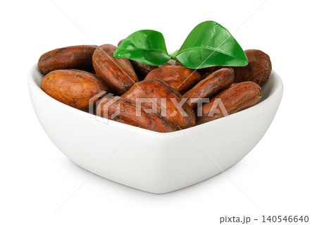 cocoa beans in ceramic bowl isolated on white background. cocoa beans in ceramic bowl isolated on white background. 140546640
