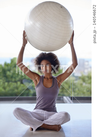 Woman, portrait and balance ball for fitness and wellness in studio with exercise and health on the floor. Happy African person with workout, pilates and holding arms up for power, strength and body Woman, portrait and balance ball for fitness and wellness in studio with exercise and health on the floor. Happy African person with workout, pilates and holding arms up for power, strength and body 140546672