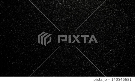 fine sparkling silver glitter texture shimmering over deep black background with cosmic night sky atmosphere 140546681