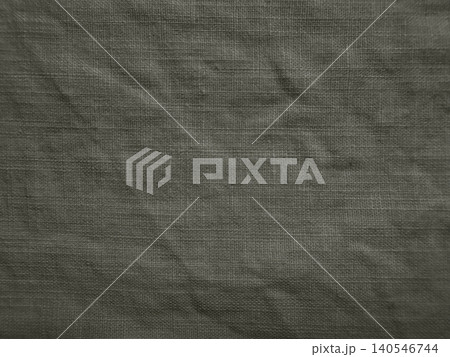 dark olive green linen fabric texture background with natural organic wrinkles and soft shadows 140546744