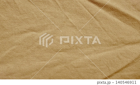 textured beige linen fabric close up shows natural creased canvas background for sustainable organic textile design textured beige linen fabric close up shows natural creased canvas background for sustainable organic textile design 140546911
