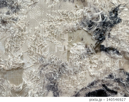 tactile textured boucle fabric reveals complex woven jacquard pattern in neutral macro detail 140546927