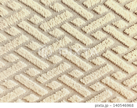textured beige fabric background featuring raised geometric patterns of parallel lines and diamonds for home interior design textured beige fabric background featuring raised geometric patterns of parallel lines and diamonds for home interior design 140546968
