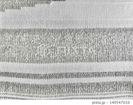 grey knit fabric texture with striped pattern captures cozy sustainable wellness aesthetic in minimalist macro detail 140547010