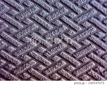 textured purple fabric background showcasing raised geometric basketweave pattern in moody macro overhead composition textured purple fabric background showcasing raised geometric basketweave pattern in moody macro overhead composition 140547073