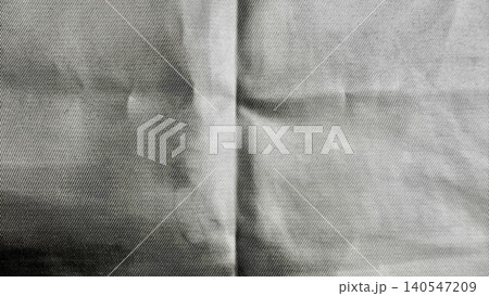 raw denim fabric macro texture revealing dramatic seams and soft folds in moody monochrome raw denim fabric macro texture revealing dramatic seams and soft folds in moody monochrome 140547209