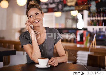 Happy, woman and phone call in coffee shop or relax in restaurant as customer in hospitality on holiday or vacation. Girl, smile and enjoy latte or espresso with virtual chat on smartphone in morning Happy, woman and phone call in coffee shop or relax in restaurant as customer in hospitality on holiday or vacation. Girl, smile and enjoy latte or espresso with virtual chat on smartphone in morning 140547355