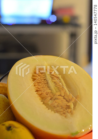Sliced melon close-up with seeds and pears 140547778